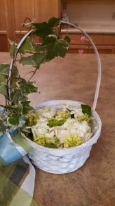 Flower girls carried baskets decorated with ivy and ribbons.