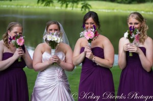 Bridesmaids carried assorted flowers.
