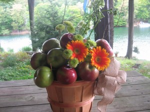 Flowers, along with apples, decorated baskets for food station tables.  