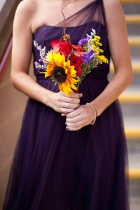 Jessica chose plum dresses and assorted fall flowers for her bridal bouquets.