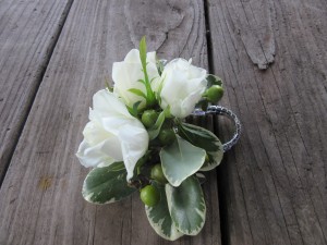 Corsages continued the flower theme of the bouquets.