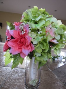 The bridal bouquet carried out her peach and bright green color scheme.