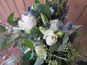 The bridal bouquet contained a blue bird of happiness.